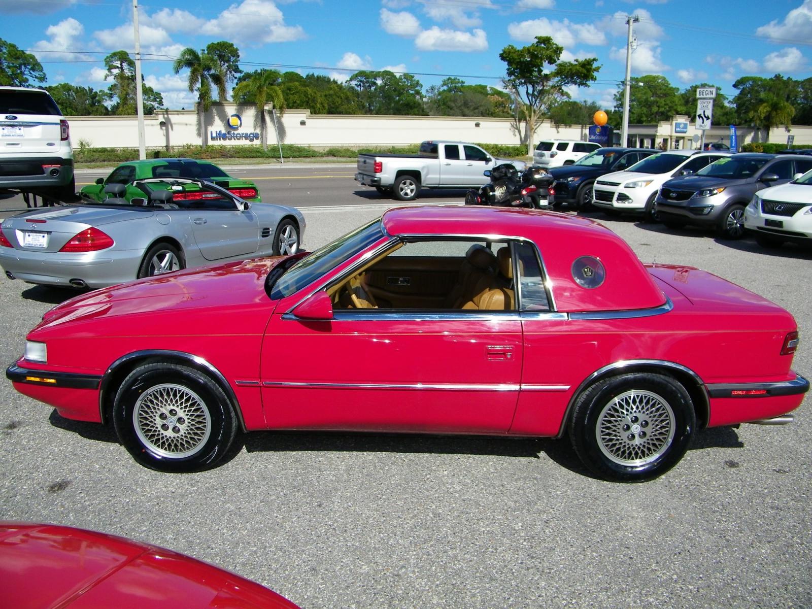 1991 Red /Beige Chrysler TC By Maserati Convertible (ZC2FS1207MB) with an 3.0L V6 SOHC 12V engine, 4-Speed Automatic Overdrive transmission, located at 4000 Bee Ridge Road, Sarasota, FL, 34233, (941) 926-0300, 27.298664, -82.489151 - Photo #2